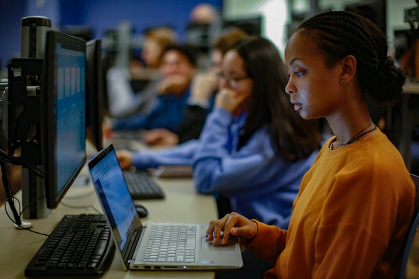 students at a bank of computers in the CS work space