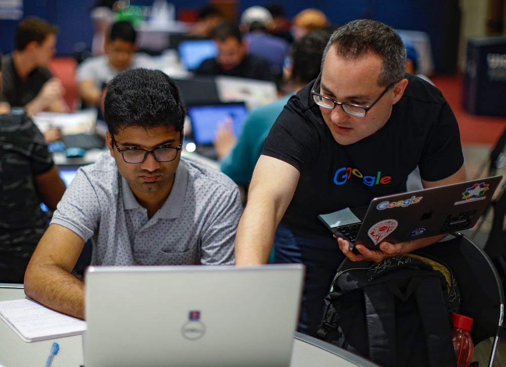 Google staff member working with students