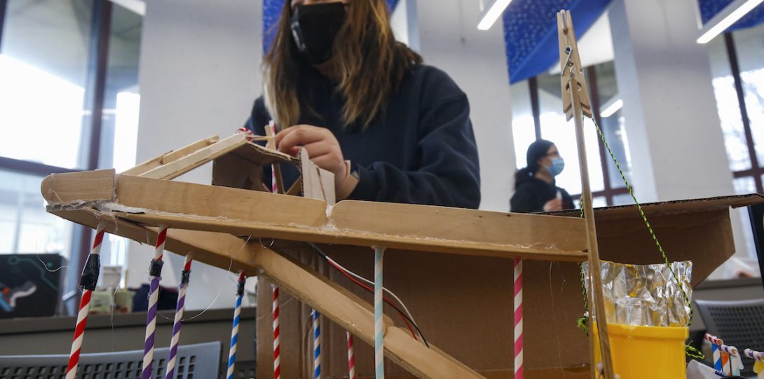 students connect their individual projects into a Rube Goldberg machine