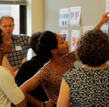 State health department staff discuss example maps they’ve created at a GIS training capacity-building session led by the Children’s Environmental Health Initiative. (Photo: courtesy of CEHI) 