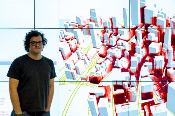 Fabio Miranda, assistant professor of computer science, stands in front of the Shadow Profiler tool he helped develop. (Photo: Martin Hernandez Rosas/UIC)