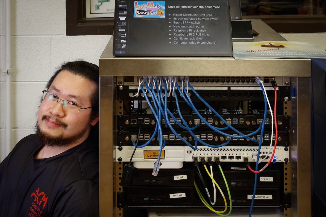 Chase Lee with ACM's server cluster